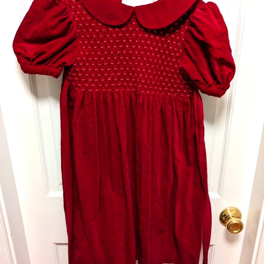 Girls red velvet holiday dress with collar and puff sleeves. Size 6-7.